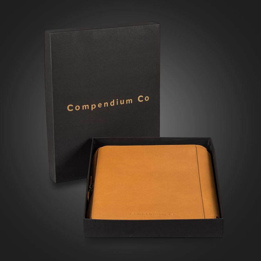 Compendium Co. tan compendium in premium black gift box with gold logo